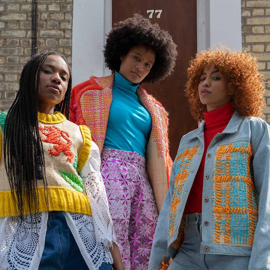 Image of three models wearing the Windrush Collection