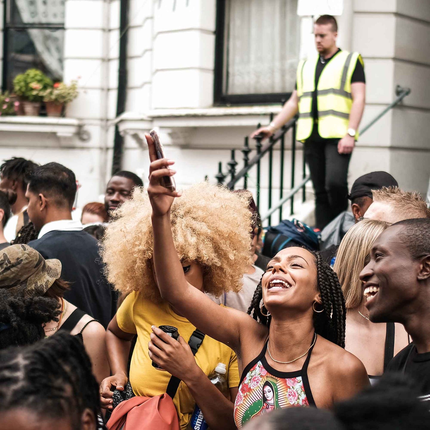People on the streets of Notting Hill Carnival in the daytime