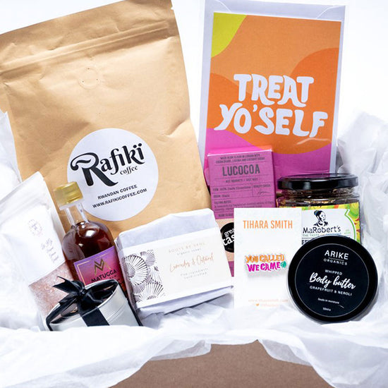 The Thriving Box Company contents including the Tihara Smith Treat Yo'self card and 'You Called, We Came' pin.