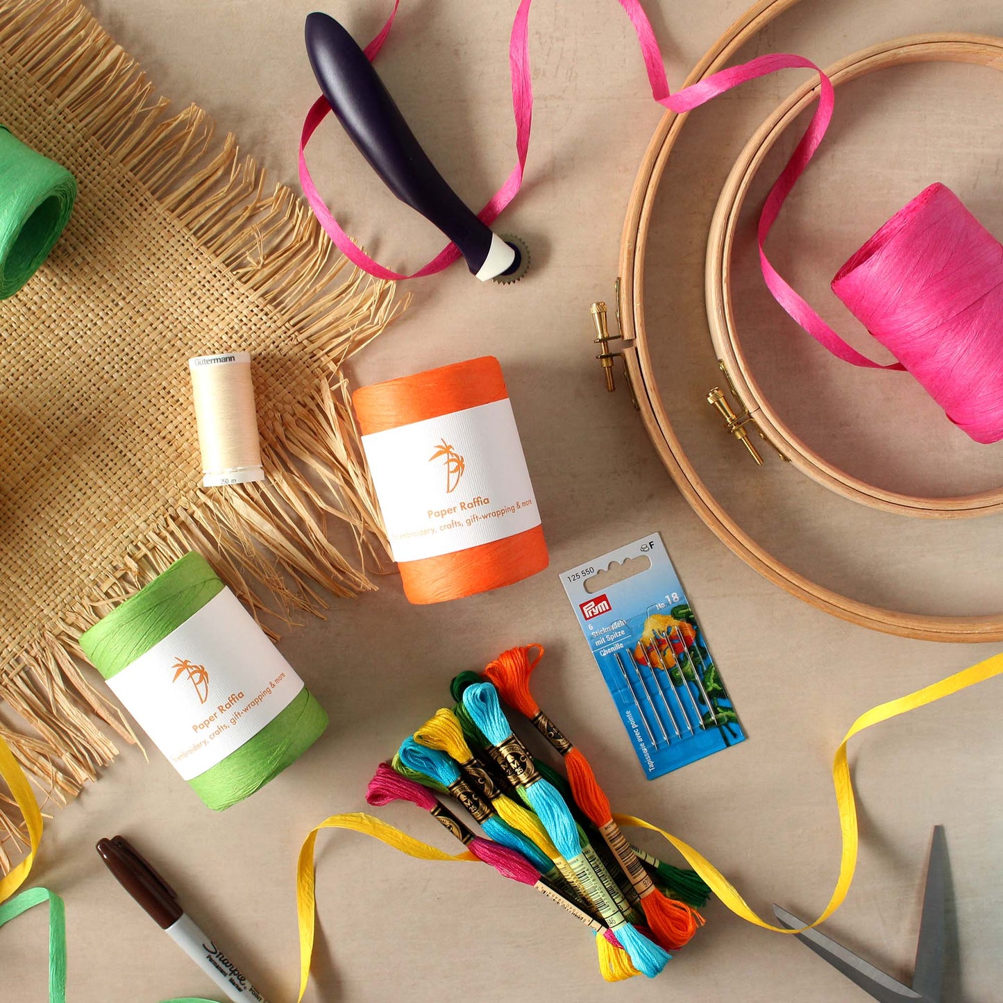 Image of raffia embroidery supplies on a table